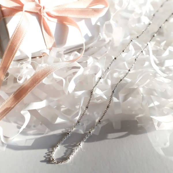 Catena sottile con elementi sferici in Argento e placcato Oro